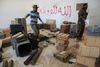 »Gud er stor,« står der i værelset i Benghazi, hvor regeringssoldater indsamler ammunition, der er efterladt af islamistiske styrker. Byen er præget af bilbomber, luftangreb og væbnede kampe. Arkivfoto: Mohammed El-Sheikhy/AP