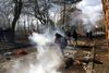 Tear gas floats in the air during clashes between migrants and Greek police, at the Turkey's Pazarkule border crossing with Greece's Kastanies, in Edirne, Turkey, February 29, 2020. REUTERS/Huseyin Aldemir