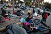 I flygtningelejren Moria på den græske ø Lesbos er tusindvis af flygtninge nu blevet hjemløse efter flere brande i lejren. Foto: Louisa Gouliamaki/AFP