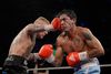 Patrick Nielsen (tv.) som her rammer argentinske Gaston Vega ved et stævne i Frederikshavn, sammenlignes ofte med Mikkel Kessler. Men ifølge boksetræner Brian Mikkelsen er sammenligningen unfair. Foto: Thomas Sjørup