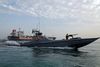 A boat of the Iranian Revolutionary Guard sails next to Stena Impero, a British-flagged vessel owned by Stena Bulk, at Bandar Abbas port, July 21, 2019. Picture taken July 21, 2019. Iran, Mizan News Agency/WANA Handout via REUTERS ATTENTION EDITORS - THIS IMAGE WAS PROVIDED BY A THIRD PARTY.