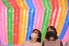 People wearing face masks walk under rows of lotus lanterns ahead of Buddha's birthday at Jogyesa Temple in Seoul on March 23, 2020. - The Association of Korea Buddhist Orders said they will postpone the Buddha's birthday celebrations, scheduled to be held on April 30, amid concerns over the COVID-19 coronavirus outbreak. (Photo by Jung Yeon-je / AFP)