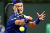 Mar 13, 2022; Indian Wells, CA, USA; Holger Rune (DEN) hits a shot against Matteo Berrettini (ITA) during his third round match at the BNP Paribas Open at the Indian Wells Tennis Garden. Mandatory Credit: Jayne Kamin-Oncea-USA TODAY Sports