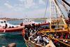 Italien vil bruge EU-formandskabet til at skabe opmærksomhed om strømmen af immigranter over Middelhavet – her i Lampedusas havn. Arkivfoto: Den italienske kystvagt/AP