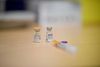 This photograph taken on December 23, 2021 shows vials of the Pfizer-BioNTech (Comirnaty) Covid-19 vaccine during the visit of France's Health Minister Olivier Veran and France's Junior Minister for Childhood and Family Affairs Adrien Taquet at vaccination centre against Covid-19, in the 5th arrondissement of Paris, as part of the vaccination of children under 12. (Photo by Eliot BLONDET / various sources / AFP)