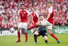 Andreas Cornelius kom tættest på at score i første halvleg, da han testede den kroatiske målmand med et fint hug med venstrefoden med Thomas Delaney som tilskuer. Foto: Gregers Tycho.
