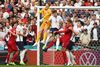 TOPSHOT - England's goalkeeper Jordan Pickford (C) deflects a corner kick during the UEFA EURO 2020 semi-final football match between England and Denmark at Wembley Stadium in London on July 7, 2021. (Photo by Andy Rain / POOL / AFP)