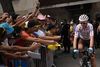 Belgium's Romain Bardet, wearing the best climber's polka dot jersey rides past fans before the nineteenth stage of the 106th edition of the Tour de France cycling race between Saint-Jean-de-Maurienne and Tignes, in Saint-Jean-de-Maurienne, on July 26, 2019. (Photo by Marco Bertorello / AFP)