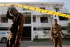 FILE PHOTO: Police keep watch outside the family home of a bomber suspect where an explosion occurred during a Special Task Force raid, following a string of suicide attacks on churches and luxury hotels, in Colombo, Sri Lanka April 25, 2019. REUTERS/Thomas Peter/File Photo