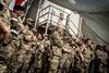 Danske soldater i Irak lytter til forsvarsminister Trine Bramsen (S), som besøgte de danske soldater, der bidrager til Nato-missionen "Nato Mission Iraq" (NMI) i Bagdad i Irak i slutningen af maj 2021. Danmark har haft ledelsen af NMI siden november 2020, hvor den blev overdraget fra Canada. - Foto: Mads Claus Rasmussen/Ritzau Scanpix