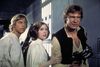 Fra venstre Mark Hamill som Luke Skywalker og Carrie Fisher som prinsesse Leia – de to tvillinger i de første udgaver af Star Wars. Til højre en ung Harrison Ford som Han Solo. Foto: AP