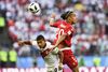 Danmarks Yussuf Poulsen var undervejs i kampen i duel med Edison Flores, der spiller i den danske superligaklub AAB. Foto: Gregers Tycho