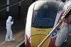 A forensic officer inspects the London North Eastern Railway (LNER) train where a series of stabbings took place, at a platform at Huntingdon Station, near Cambridge, Britain, November 2, 2025. REUTERS/Jack Taylor