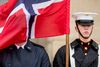 A Norwegian flag flies in the face of a member of a the military during a ceremony to welcome Norwegian Defense Minister Frank Bakke-Jensen to the Pentagon in Washington, Tuesday, March 20, 2018. (AP Photo/Andrew Harnik)