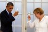 Den amerikanske præsident Barack Obama skåler med den tyske forbundskansler Angela Merkel.