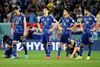 Triste japanske spillere efter 120 minutters kamp og straffespark. Foto: Ina Fassbender/AFP
