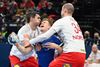 Iceland's Elvar Asgeirsson (C) is tackled by Denmark's Simon Hald Jensen (R) and Denmark's Rasmus Lauge Schmidt (L) during the Men's European Handball Championship main round day 2 Group I match between Denmark and Iceland at the MVM Dome in Budapest, Hungary, on January 20, 2022. (Photo by Attila KISBENEDEK / AFP)