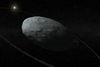 Haumea er en dværgplanet ligesom Pluto, men knap så kendt. Nu har astronomer endelig set nærmere på Haumea og dens ring, der ser nogenlunde sådan her ud. Illustration: IAA-CSIC/UHU