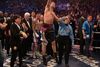 Kampleder Pete Podgorski hæver Carl Froch's arm, mens Nottingham-bokseren springer af glæde efter nattens sejr.