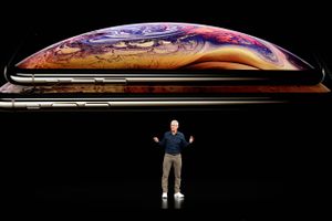 Apple CEO Tim Cook discusses the new iPhone XS and iPhone XS Max at the Steve Jobs Theater during an event to announce new products Wednesday, Sept. 12, 2018, in Cupertino, Calif. (AP Photo/Marcio Jose Sanchez)