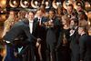 Filminstruktør Steve McQueen fejrede Oscar-sejren med et kraftspring på scenen i Dolby Theatre.