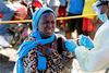 FILE PHOTO: A young woman reacts as a health worker injects her with the Ebola vaccine, in Goma, Democratic Republic of Congo, August 5, 2019. REUTERS/Baz Ratner/File Photo