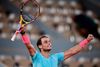 Rafael Nadal stiler efter at tangere Roger Federers rekord på 20 grand slam-titler. Foto: Martin Bureau/AFP
