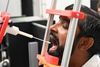 Professor Thiusius Rajeeth Savarimuthu fra SDU Robotics er ekspert i robotter til sundhedssektoren. Han testes her af sin egen robot for Covid-19. - Foto: SDU/Free