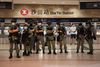 Police stand at a metro station near a pro-democracy protest inside the New Town Plaza mall in Sha Tin in Hong Kong, China June 12, 2020. REUTERS/Laurel Chor