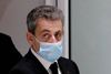 FILE PHOTO: Former French President Nicolas Sarkozy leaves the courtroom during his trial on charges of corruption and influence peddling, at Paris courthouse, France, December 7, 2020. REUTERS/Benoit Tessier/File Photo