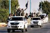 Militante islamistiske kamptropper fra Islamisk Stat fejrer, at de har udråbt en Islamisk Stat i den nord syriske by Raqqa i juni 2014. Arkivfoto: Reuters/Stringer