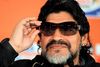 FILE PHOTO: Argentina's coach Diego Maradona tries on sunglasses before a news conference ahead of their June 22 World Cup soccer match against Greece, at the Loftus Versfeld Stadium in Pretoria, South Africa June 21, 2010. REUTERS/Enrique Marcarian/File Photo