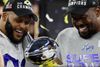 American Football - NFL - Super Bowl LVI - Cincinnati Bengals v Los Angeles Rams - SoFi Stadium, Inglewood, California, United States - February 13, 2022 Los Angeles Rams' Von Miller and Aaron Donald celebrate with the Vince Lombardi Trophy after winning Super Bowl LVI REUTERS/Mike Segar