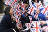 Meghan Markle er feminist og ses her ved et arrangement på kvindernes internationale kampdag, den 8. marts. Hun er stadig amerikansk statsborger, og skal nu igennem den almindelige proces for at blive britisk statsborger. Foto: Paul Ellis/AFP.