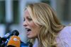 Adult film actress Stormy Daniels speaks to members of the media after a hearing at federal court Monday, April 16, 2018, in New York. A judge considering how to handle records seized in an FBI raid on the home and office of Michael Cohen, President Donald Trump's personal attorney, wrapped up a hearing into the matter Monday without making a final decision. The search sought information on a variety of matters, including a $130,000 payment made to Daniels, who alleges she had sex with Trump in 2006. (AP Photo/Craig Ruttle)