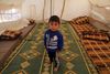 Toårige Walid al-Khaled er blandt de syriske børn, der er fordrevet fra byen Aleppo i Syrien. Han står her i et telt i Atmeh-lejren nær den tyrkiske grænse. På en konference tirsdag vil Danmark give tilsagn om hjælp til Syrien og dets nabolande for 705 mio. kr., hvoraf 360 mio. er til humanitære indsatser. Foto: Khalil Ashawi/Reuters