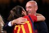 EDITORS NOTE: Graphic content / Spain's defender #20 Rocio Galvez (L) is congratuled by President of the Royal Spanish Football Federation Luis Rubiales (R) after winning the Australia and New Zealand 2023 Women's World Cup final football match between Spain and England at Stadium Australia in Sydney on August 20, 2023. (Photo by FRANCK FIFE / AFP)
