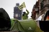 A protester holds a flag at a camp at the Trafalgar Square during an Extinction Rebellion demonstration in London, Britain, October 12, 2019. REUTERS/Henry Nicholls TPX IMAGES OF THE DAY