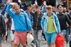 Flygtninge ankommer til togstationen i München.