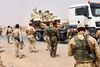 Kurdiske styrker blev torsdag indsat uden for Kirkuk i det nordlige Irak. De er blandt andet bevæbnede med kampvogne som her på blokvognen.