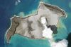 Toppen af den undersøiske vulkan Hunga Tonga-Hunga Ha’apai fotograferet den 7. januar. Efter lørdagens udbrud er størstedelen af øen sprængt væk. Foto: Planet Labs/AFP
