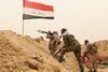 Shiamuslimske militser kæmper mod militante grupper fra Islamisk Stat i udkanten af Fallujah tæt på Bagdad. Foto: AP