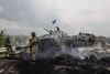 Ukrainske styrker gør holdt ved resterne af en kontrolpost, som tidligere blev holdt af prorussiske separatister. Foto: Zumapress