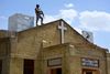 A Pakistani soldier stands guard on the roof of a Methodist Church during the Easter service in Quetta on April 21, 2019. - A series of eight devastating bomb blasts ripped through high-end hotels and churches holding Easter services in Sri Lanka on April 21, killing nearly 160 people, including dozens of foreigners. (Photo by BANARAS KHAN / AFP)