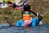Migranter i tusindvis, heraf mange fra Haiti, har de seneste måneder krydset floden Rio Grande for at komme fra Mexico ind i Texas. Foto: Daniel Becerril/Reuters
