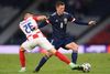 Scotland's midfielder Callum McGregor (R) is marked by Croatia's midfielder Luka Ivanusec during the UEFA EURO 2020 Group D football match between Croatia and Scotland at Hampden Park in Glasgow on June 22, 2021. (Photo by Stu Forster / POOL / AFP)
