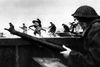 (FILES) In this file photo taken on June 6, 1944 Canadian soldiers land on Courseulles beach in Normandy as Allied forces storm the Normandy beaches on D-Day. - In what remains the biggest amphibious assault in history, some 156, 000 Allied personnel landed in France on June 6, 1944. An estimated 10, 000 Allied troops were left dead, wounded or missing, while Nazi Germany lost between 4, 000 and 9, 000 troops, and thousands of French civilians were killed. The 75th anniversary of the D-day landings will fall on June 6, 2019. (Photo by - / Canadian Armed Forces / AFP)
