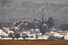 Luftangrebene fra den amerikanskledede koalition og det blodige slag om den syriske grænseby Kobani har presset Islamisk Stat. Foto: Vadim Ghirda/AP