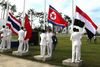 Nordkoreas flag på vej til tops sammen med bl.a. Kinas og Thailands ved åbningen af Asian Games 2014.