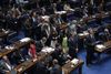 Dilma Rousseff fjernes fra posten som brasiliansk præsident, efter anklager om at hun på ulovlig vis har sminket statens budget. Foto: Eraldo Peres/AP